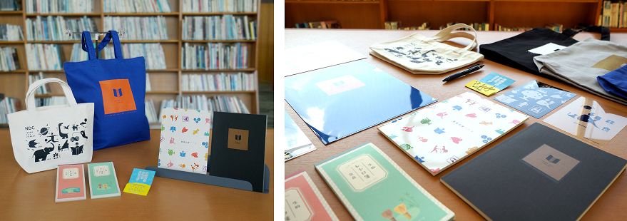 生駒市図書館オリジナルグッズの大トートバッグ、小トートバッグ、読書記録ノート、A5罫ノート、クリアファイル、文庫サイズふせん、ボールペン。市史編さん事業PRグッズの一筆箋、生駒市のかたちのクリップ。